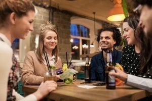 Group of Friends Enjoying a Drink in a profitable bar